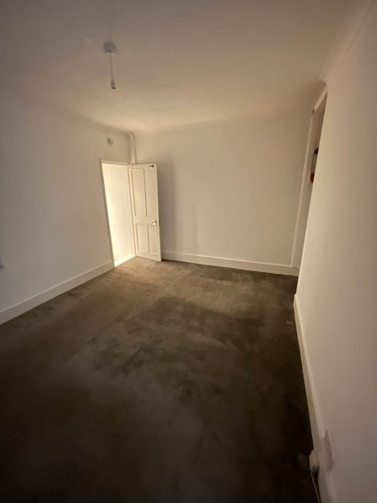 An empty room at the end of a tenancy, cleared of belongings and ready to be cleaned.